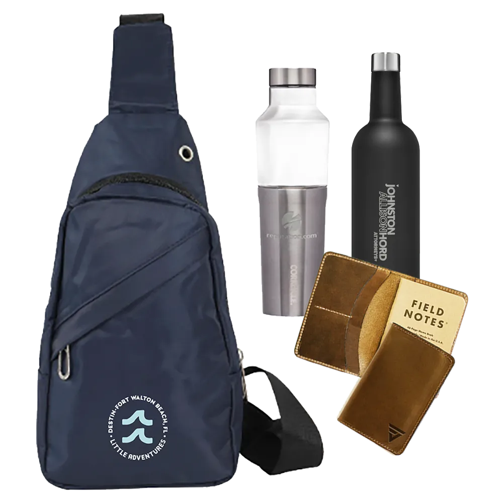 Navy branded sling bag, insulated bottles, tumbler and leather notebook laid out together