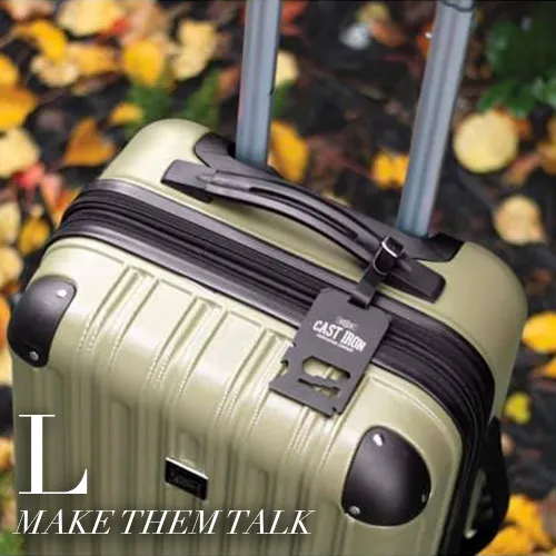 Olive hard-shell suitcase with a custom engraved leather luggage tag