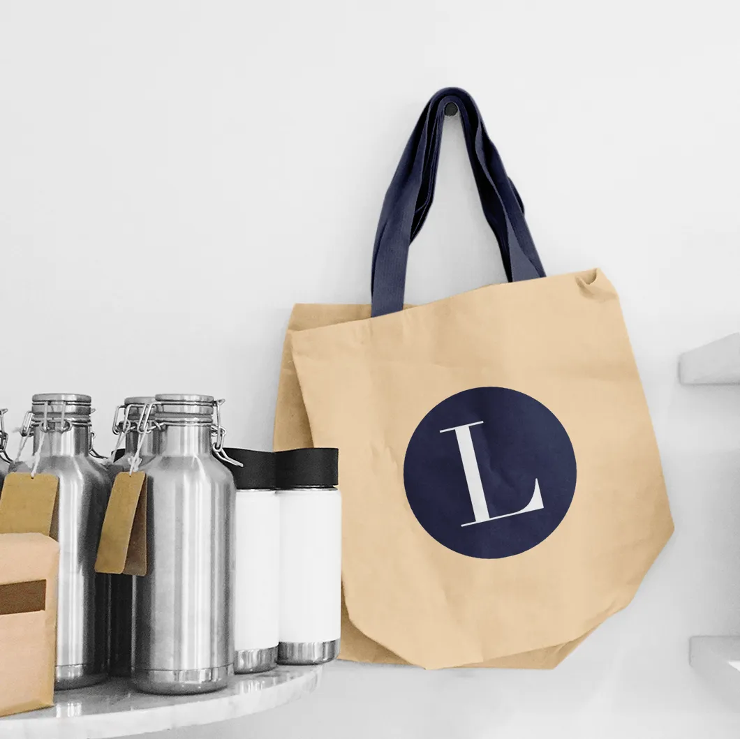 Canvas tote bag and stainless bottles printed with the Lavish L monogram