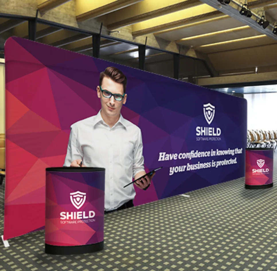 Branded trade show booth with backdrop banner and podium